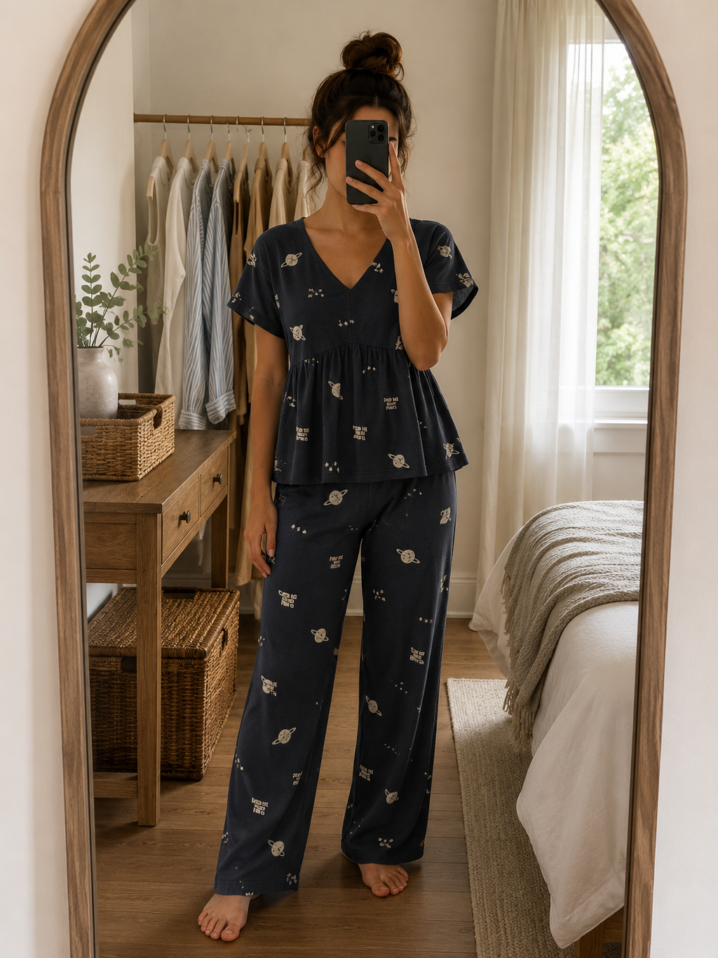 Premium black knitted cotton fabric featuring a minimal planet print for women's round-neck T-shirt and matching lounge pants night suit by Irah Vastra.