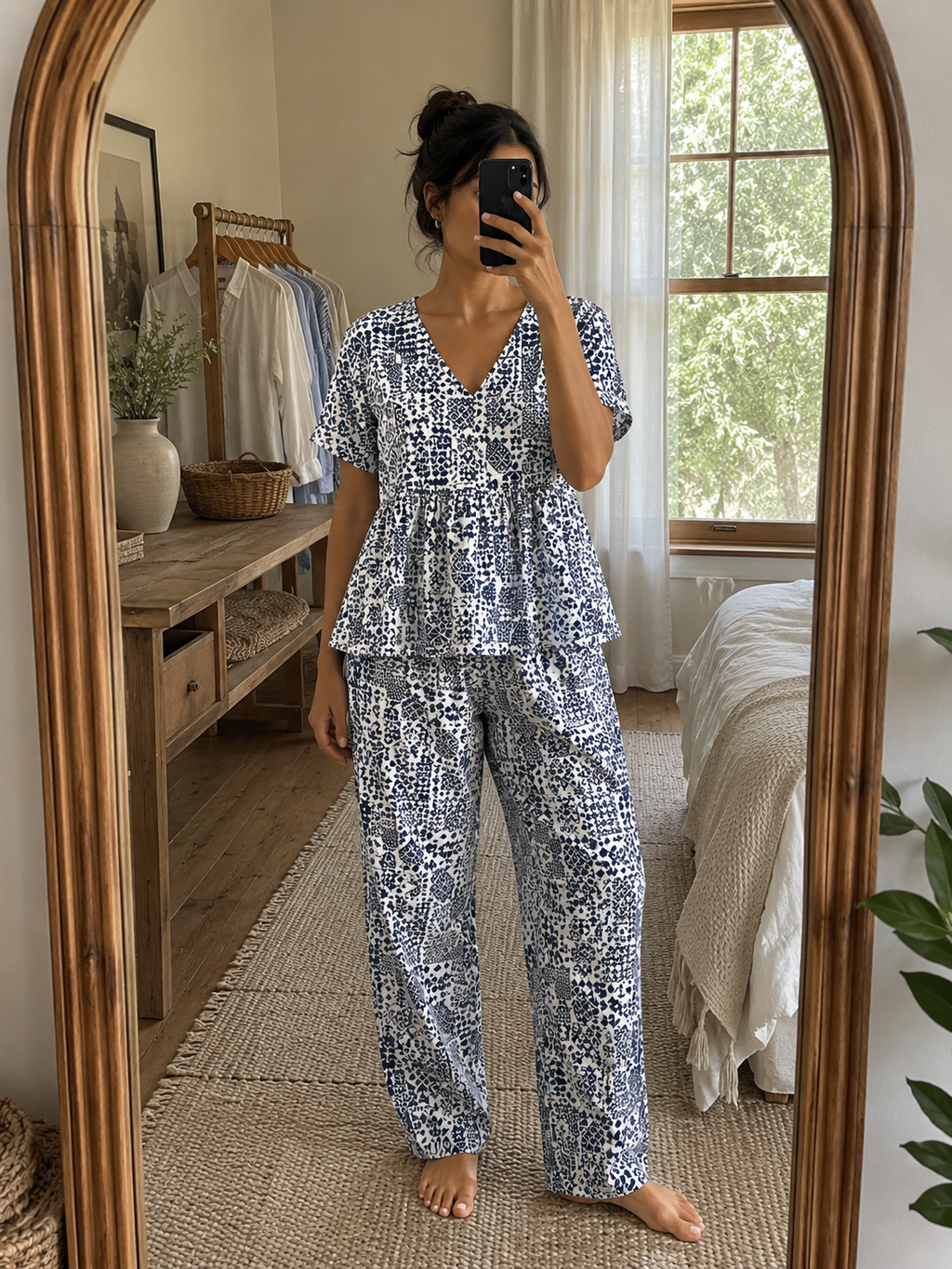 Woman wearing a premium white and indigo mosaic print cotton peplum night suit with a V-neck top and matching straight-fit lounge pants by Irah Vastra