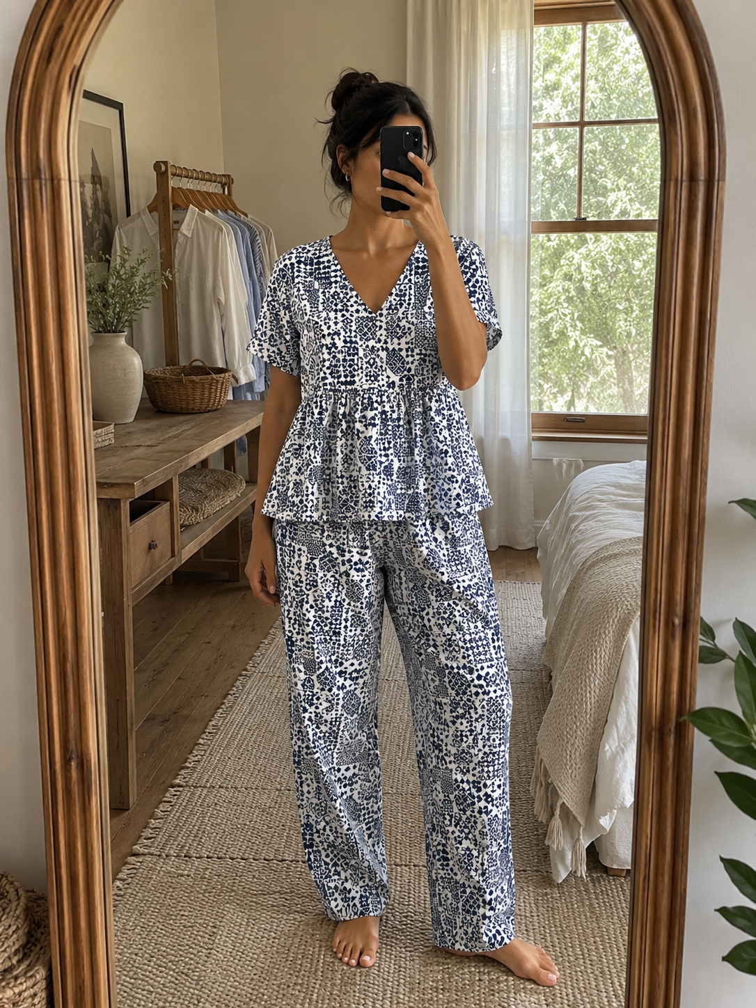 Woman wearing a premium white and indigo mosaic print cotton peplum night suit with a V-neck top and matching straight-fit lounge pants by Irah Vastra
