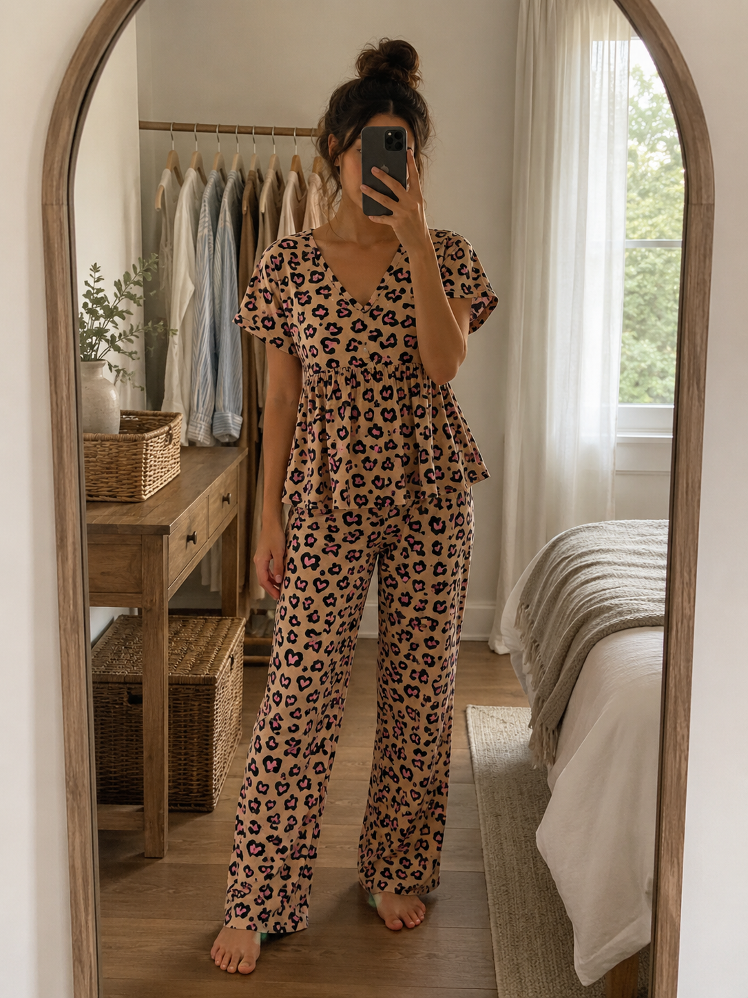Woman wearing a premium mocha brown leopard print cotton peplum night suit with a V-neck top and matching straight-fit lounge pants by Irah Vastra.