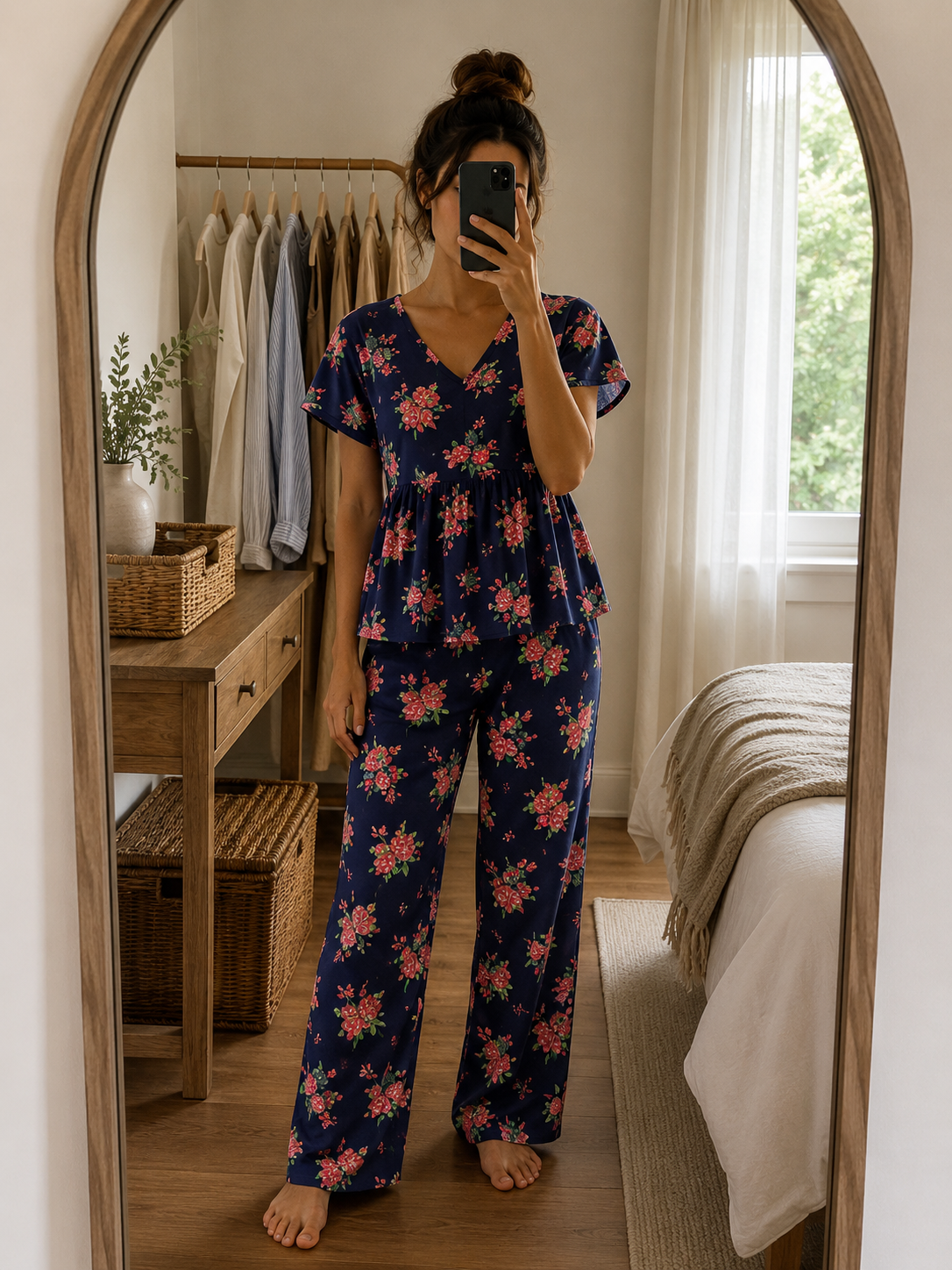 Woman wearing a premium navy blue ribbed knitted cotton peplum night suit with floral print, V-neck top, and matching straight-fit lounge pants by Irah Vastra.